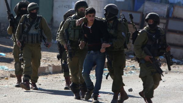 A Palestinian youth was arrested by Israeli police in Qabatiya on 4 February. (AFP/File)