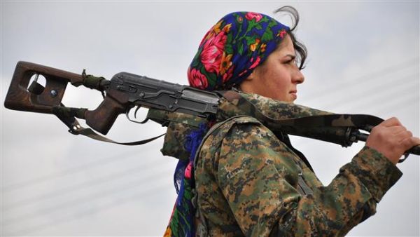 A Kurdish female fighter of the People's Protection Units (YPG) looks on at a training camp near the Syrian-Turkish border on February 13, 2015. (AFP/File)