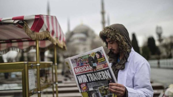 A headline in German reads 'We mourn" in a Turkish newspaper the day after the Istanbul attack. (AFP/Bulent Kilic)