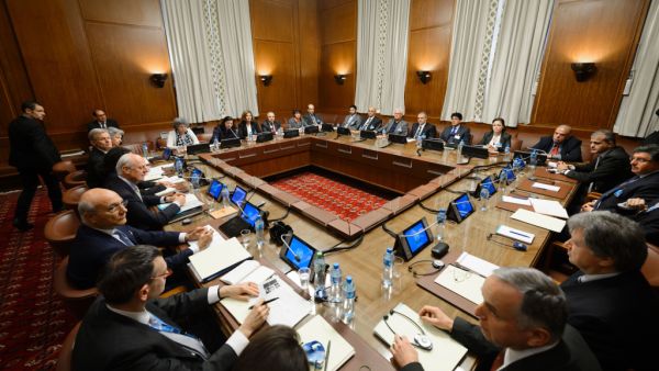 United Nations special envoy Staffan de Mistura (C-L) sits facing Syria’s main opposition group during Syrian peace talks at the U.N. Offices in Geneva on February 1, 2016. (AFP/Fabrice Coffrini)
