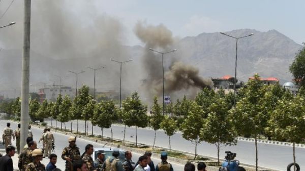 Black smoke billows from the Afghan parliament building in Kabul on June 22, 2015. (AFP/Shah Marai)