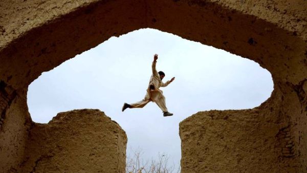 An Afghan boy plays in the ruins of a house that at one point belonged to the 13th-century Persian poet, Islamic scholar and Sufi mystic Jalal ad-Din Muhammad Rumi on the outskirts of Mazar-i-Sharif on November 25, 2015. (AFP/Farshad Usyan)