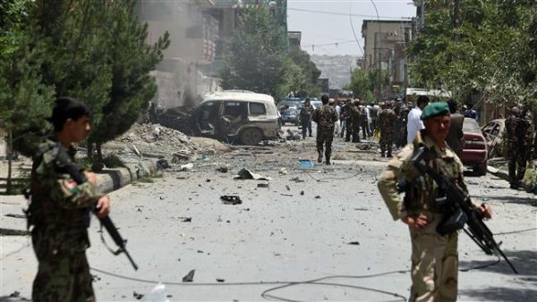 Afghan security forces stand alert at the site of a bomb blast that targeted NATO forces. (AFP/File) 