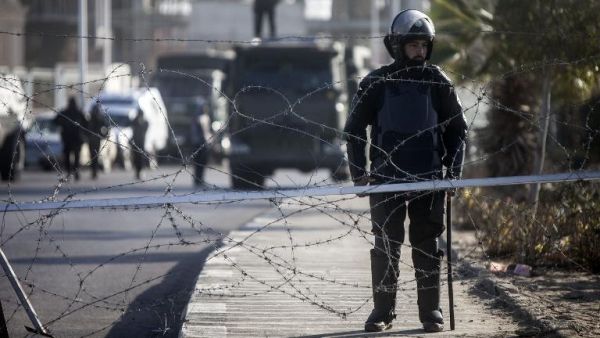 Illustrative photo of Egyptian riot police stand guard in Cairo, January 28, 2014. (AFP/File)
