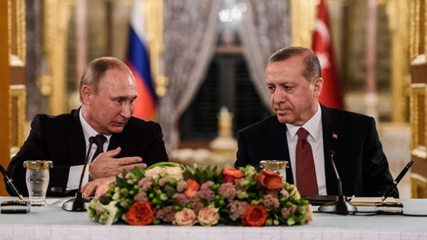 This file photo taken on October 10, 2016 shows Russian President Vladimir Putin (L) speaking to Turkish President Recep Tayyip Erdogan (R) as they attend a press conference in Istanbul (AFP/File) 