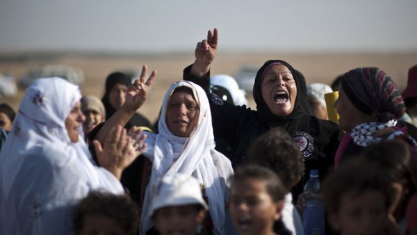Bedouin women shout slogans during a protest in the Negev desert. (AFP/File)