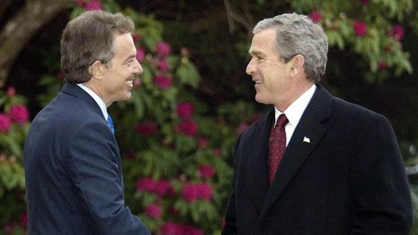Photo taken on April 8, 2003 shows former US President George W. Bush (R) greets former British Prime Minister Tony Blair (L) at Hillsborough Castle in Northern Ireland. (AFP/File)