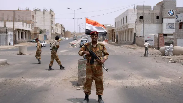 A Yemeni army officer looks on while standing at a checkpoint in Sanaa, Yemen. (AFP/File)