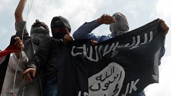 Daesh supporters wave the Shahada flag. (AFP/File)