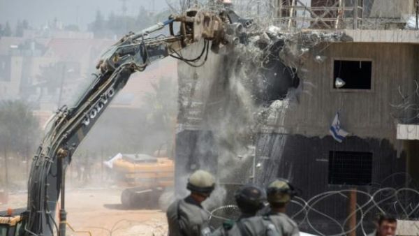 Jewish settlers in the occupied West Bank and East Jerusalem, who number between 500,000 and 600,000, receive four times as many housing units as Palestinian citizens in Israel. (AFP/File)