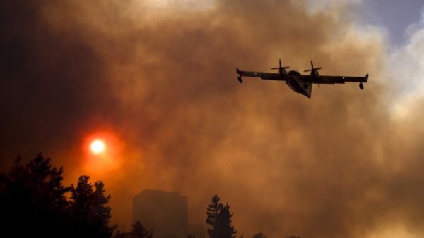 An Israeli firefighter plane helps extinguish a fire in the northern Israeli port city of Haifa. (AFP/File)