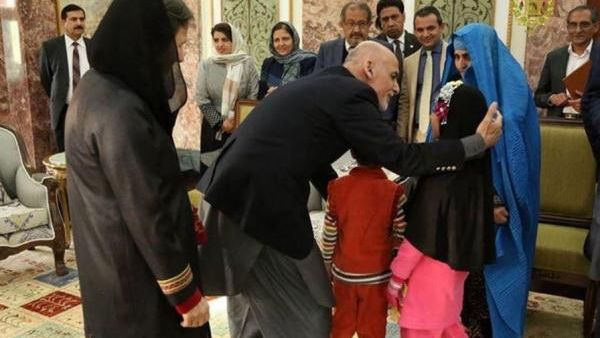 Sharbat Gula, seen in this image dressed in blue, the subject of the "Afghan Girl" National Geographic cover, was deported from Pakistan to Afghanistan on Wednesday and met with Afghan President Ashraf Ghani. (Courtesy photo)