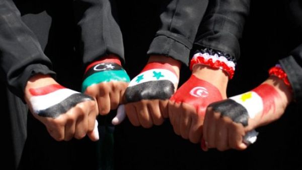 Yemeni women show their hands painted with flags of Arab nations. (AFP/File)