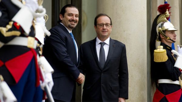 French President Francois Hollande, right, with former Lebanese prime minister Saad Hariri upon his arrival for a meeting at the Elysee Palace. (AFP/File)