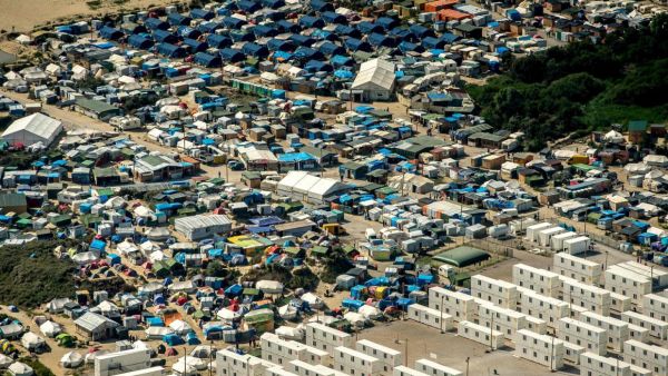 Migrants, including many children, have lived at the camp for the last 18 months. They will now be relocated. (AFP/File)