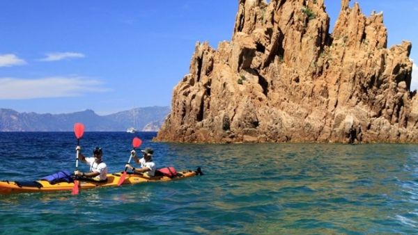 Racers ride kayaks during the 20th Corsica Raid race in Porto on the French island of Corsica. (AFP/Pascal Pochard-Casabianca)