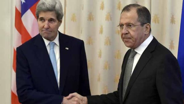 Russian Foreign Minister Sergei Lavrov shakes hands with US Secretary of State John Kerry during their meeting in Moscow on December 15, 2015. (AFP/File)