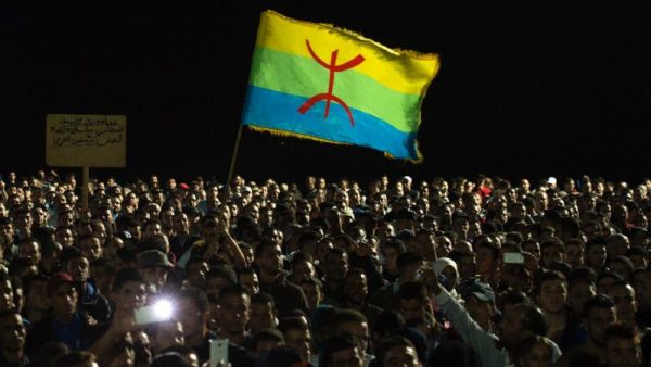 Moroccans carry the Berber flag at a protest in Al Hoceima on October 30, 2016. (AFP/File)