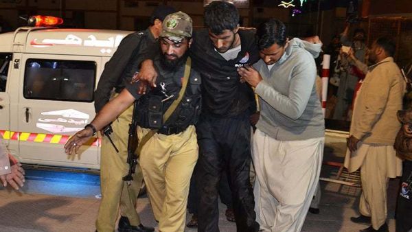 A volunteer and a police officer rush an injured person to a hospital in Quetta. (AFP/File)