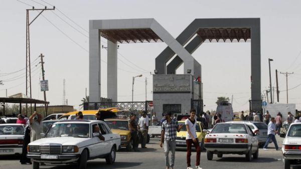 Vehicles drive through the Rafah border crossing point in the southern Gaza Strip on 19 September 2013. (AFP/File)