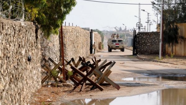 An Egyptian army vehicle patrols along the border with the Gaza Strip in the divided border town of Rafah on November 4, 2014.