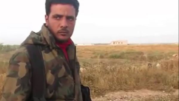 Video still of rebel heart-eater in Syria. (YouTube)