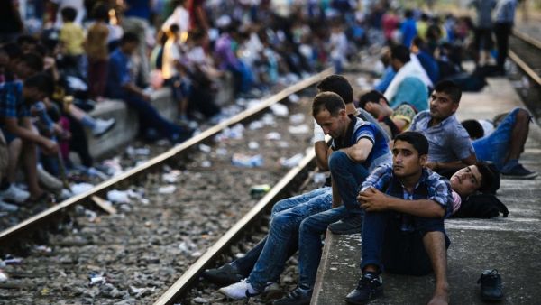 Refugees wait for a train heading to Serbia at the Gevgelija railway station, on the Macedonian-Greek border on July 28, 2015. (AFP/Dimitar Dilkoff)