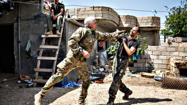 A 67-year-old man from Canada and a 40-year-old from the UK, nick-named by Kurdish fighters as Hewal Zinar and Hewal Cudi, train on the outskirts of the north-western Syrian town of Tal Tamr, north of Hasakeh, near the border with Turkey, as they fight alongside People Protection Unit (YPG) fighters under the commanders, Sider and Gerzan. (AFP/Uygar Onder Simsek)