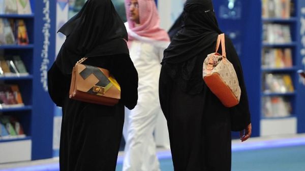Fully veiled Saudi women browse the annual International Book Exhibition in the capital Riyadh on March 2016. (AFP/File)
