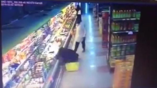 A still image from a video posted on YouTube shows a Saudi woman on the floor after being shoved by an expatriate man. (YouTube)
