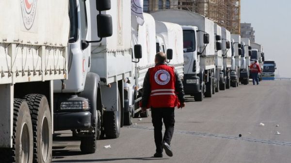 A Red Crescent convoy prepares to leave Damascus to the besieged areas of Madaya and Zabadani. (AFP/File)