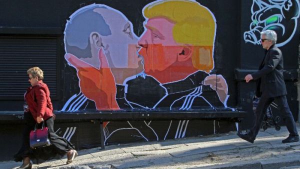 US President Donald Trump and Russian President Vladimir Putin greet each other with a kiss in this mural in the Lithuanian capital Vilnius. (AFP/File)