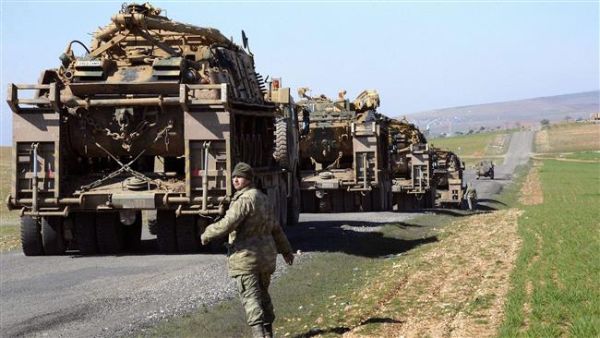Turkish Army vehicles and tanks move near the Syrian border in rural district of Suruç. (AFP/File)