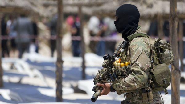A Tunisian soldier guards the beach at the Riu Imperial Marhaba Hotel in Port el Kantaoui, on the outskirts of Sousse, in the wake of the attack which killed 38 people. (AFP/File)