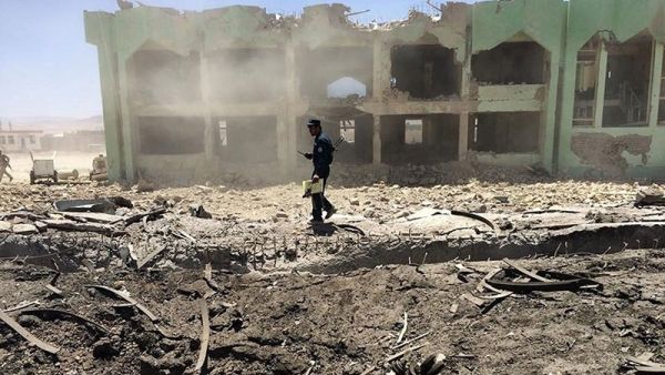 An Afghan policeman inspects the site of a suicide attack in Zabul on May 25, 2015. (AFP/File)