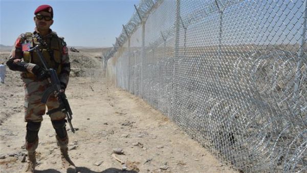 A Pakistani army soldier stands guard along the fence at the Pak-Afghan border near the Punjpai area of Quetta in Balochistan. (AFP)
