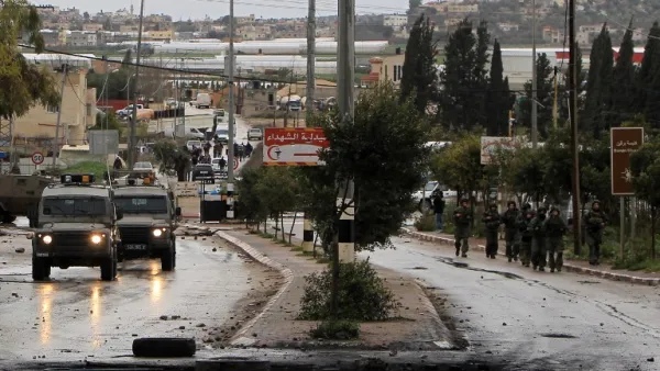 Israeli security forces advancing on the village of Qabatiya, near the West Bank town of Jenin on February 6, 2016. (AFP/Jaafar Ashtiyeh)