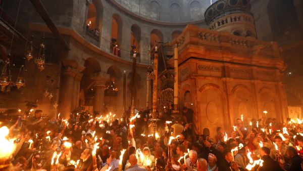 Christian orthodox worshippers hold candles during the "Holy Fire" Easter celebration in Jerusalem's Church of the Holy Sepulchre, Saturday 15 April 2017. (AFP/Gali Tibbon)