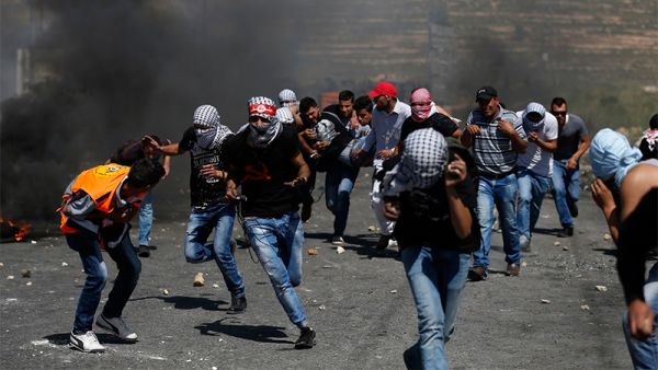 A protest in support of Palestinian prisoners on hunger strike in Israeli jails, near the Jewish settlement of Beit El, north of the West Bank city of Ramallah on May 11, 2017. (AFP)