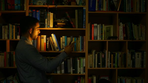 Mossab Abu Toha is struggling to open the first English-language library in Gaza. (AFP/File) 