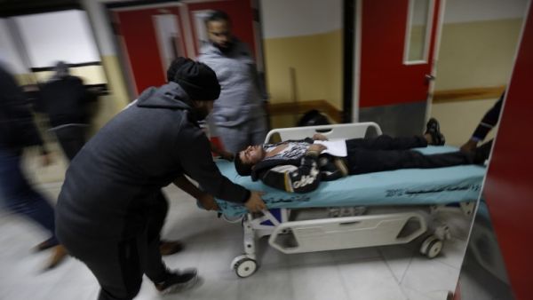 An injured Palestinian man arrives at a hospital to receive treatment following an Israeli air strike in Beit Lahia, in the northern Gaza Strip, on December 8, 2017 (Mohammed Abed/AFP)