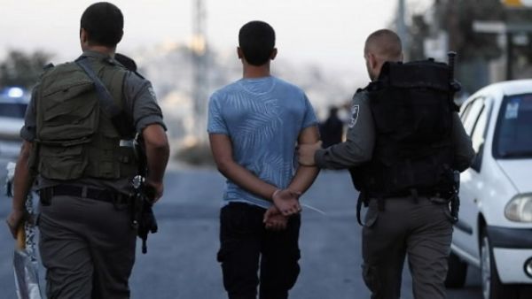 Israeli security forces arrest a Palestinian youth in East Jerusalem. (AFP)