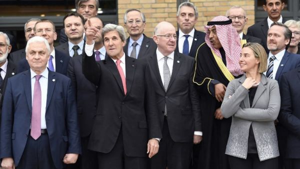 US Secretary of State John Kerry (2nd L) gestures next to Russian Ambassador to France Alexander Orlov (L) and European Union Foreign Policy Chief Federica Mogherini as they take part with other representatives during the Mideast peace conference in Paris on January 15, 2017. (AFP/Bertrand Guay)