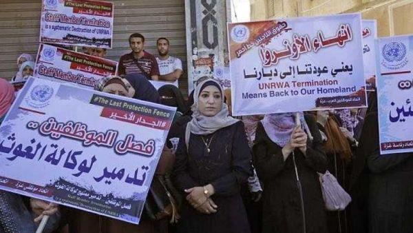 Palestinian employees of United Nations Relief and Works Agency (UNRWA) take part in a protest against job cuts by UNRWA, in Gaza City. (AFP/ SAID KHATIB)