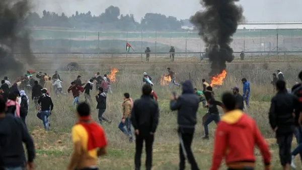 Palestinian protesters clash with Israeli soldiers near the border fence east of Gaza City. (AFP/File)