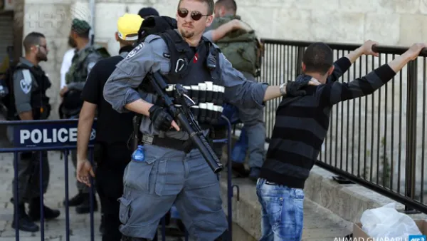 Israeli forces stop and search a Palestinian boy at the entrance of Damascus Gate, outside Jerusalem's Old City. ( AFP / Ahmad Gharabli)
