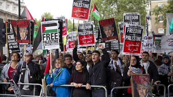 Pro-Palestinian demonstrators shout slogans as they gather to a protest outside the gates of Downing Street in London. (AFP/ File Photo)
