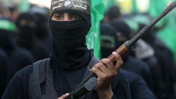 Palestinian militants of the Ezzedine al-Qassam Brigades, the Hamas' armed wing, take part in a rally in Gaza City. (photo credit: MAHMUD HAMS / AFP)