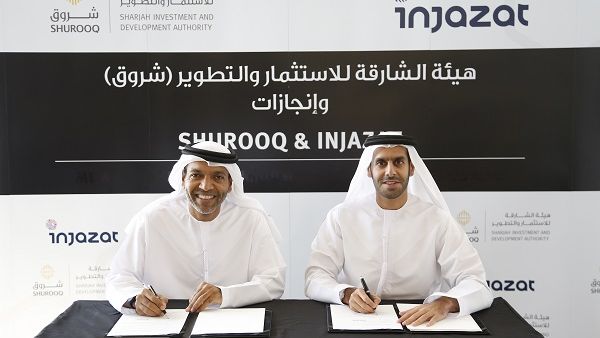 Partnership agreement being signed between  Injazat CEO, Khaled Al Melhi, left, and Shurooq’s Executive Chairman H.E. Marwan bin Jassim Al Sarkal