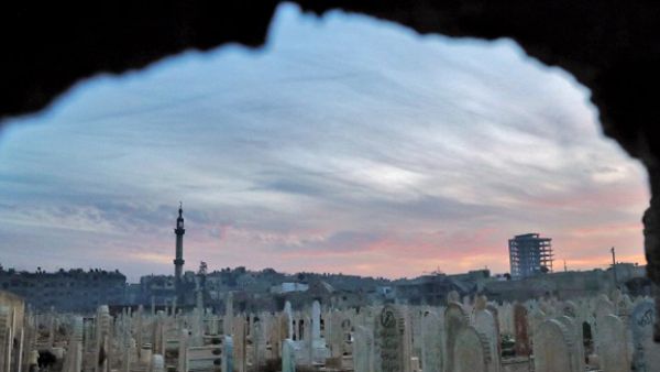 A general view shows a cemetery in the rebel-held town of Douma. The city, on the outskirts of the capital Damascus, is surrounded and regularly shelled by regime forces. (AFP/File)